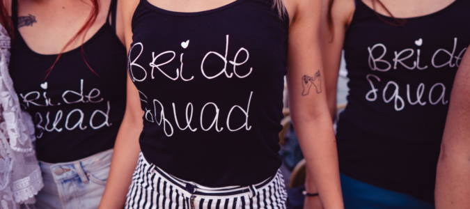 three women wearing bride squad tshirts